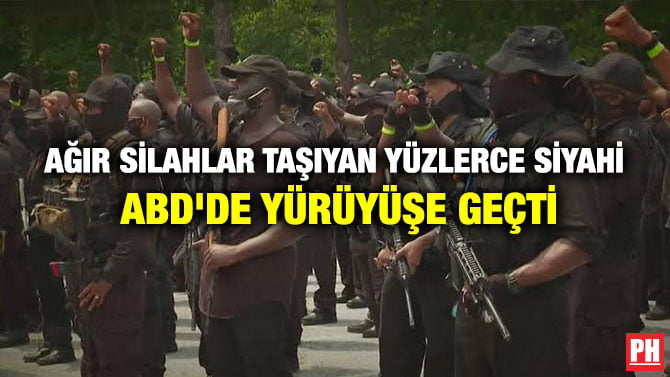AĞIR SİLAHLAR TAŞIYAN YÜZLERCE SİYAHİ ABD’DE YÜRÜYÜŞE GEÇTİ