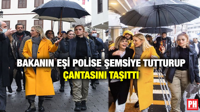 Bakanın Eşi Polise Şemsiye Tutturup Çantasını Taşıttı